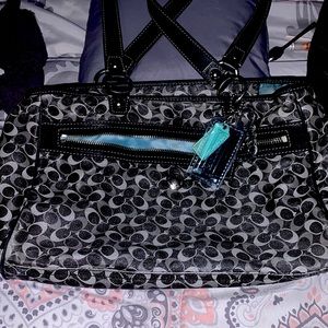 Authentic black blue and grey coach purse in good condition.